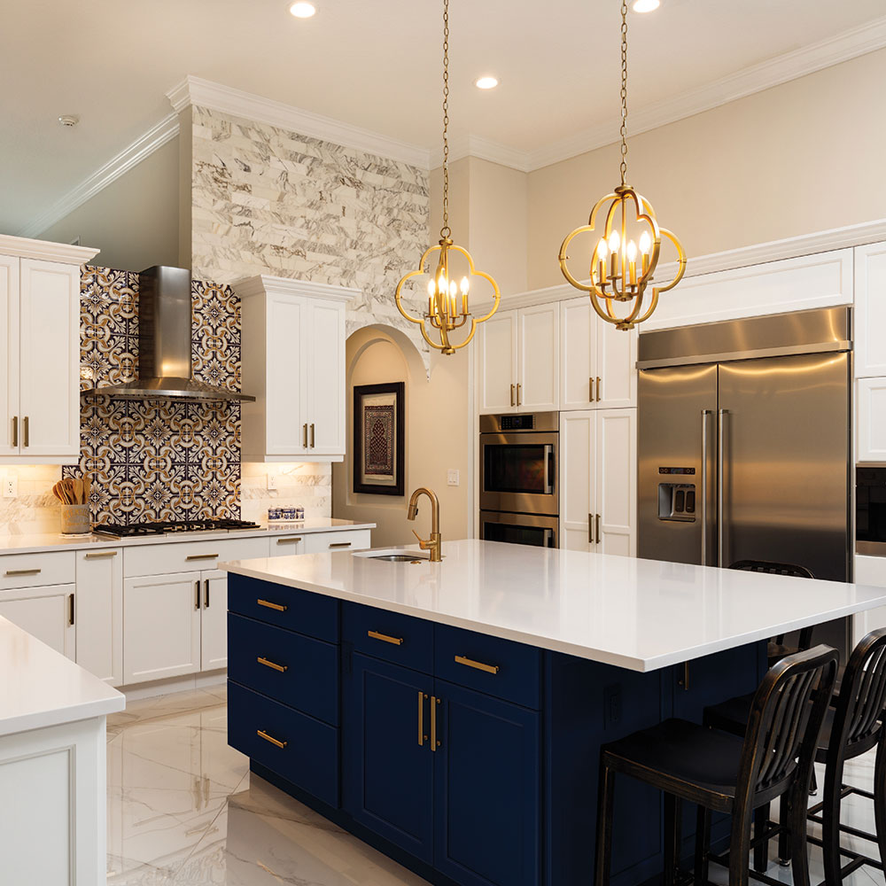 newly renovated kitchen featuring dark blue cabinetry on the central island