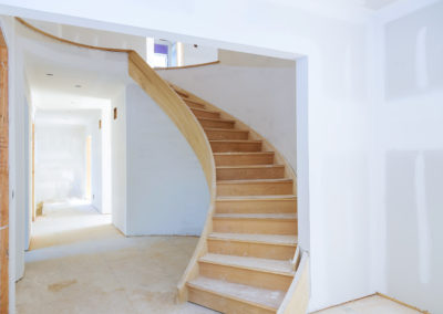 Stunning wooden staircase with intricate carvings and a rich finish