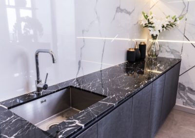New bathroom sink counter tops featuring beautiful new black marbling.