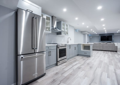 Renovated basement with small cutom made kitchen and new floorig, fresh paint and ceiling pot lights