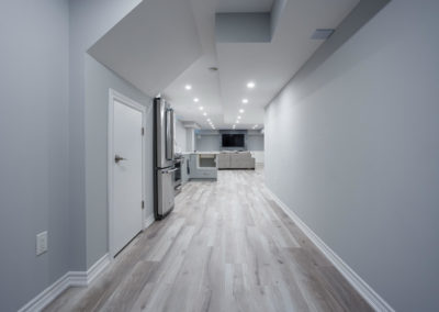 Renovated basement with small cutom made kitchen and new floorig, fresh paint and ceiling pot lights