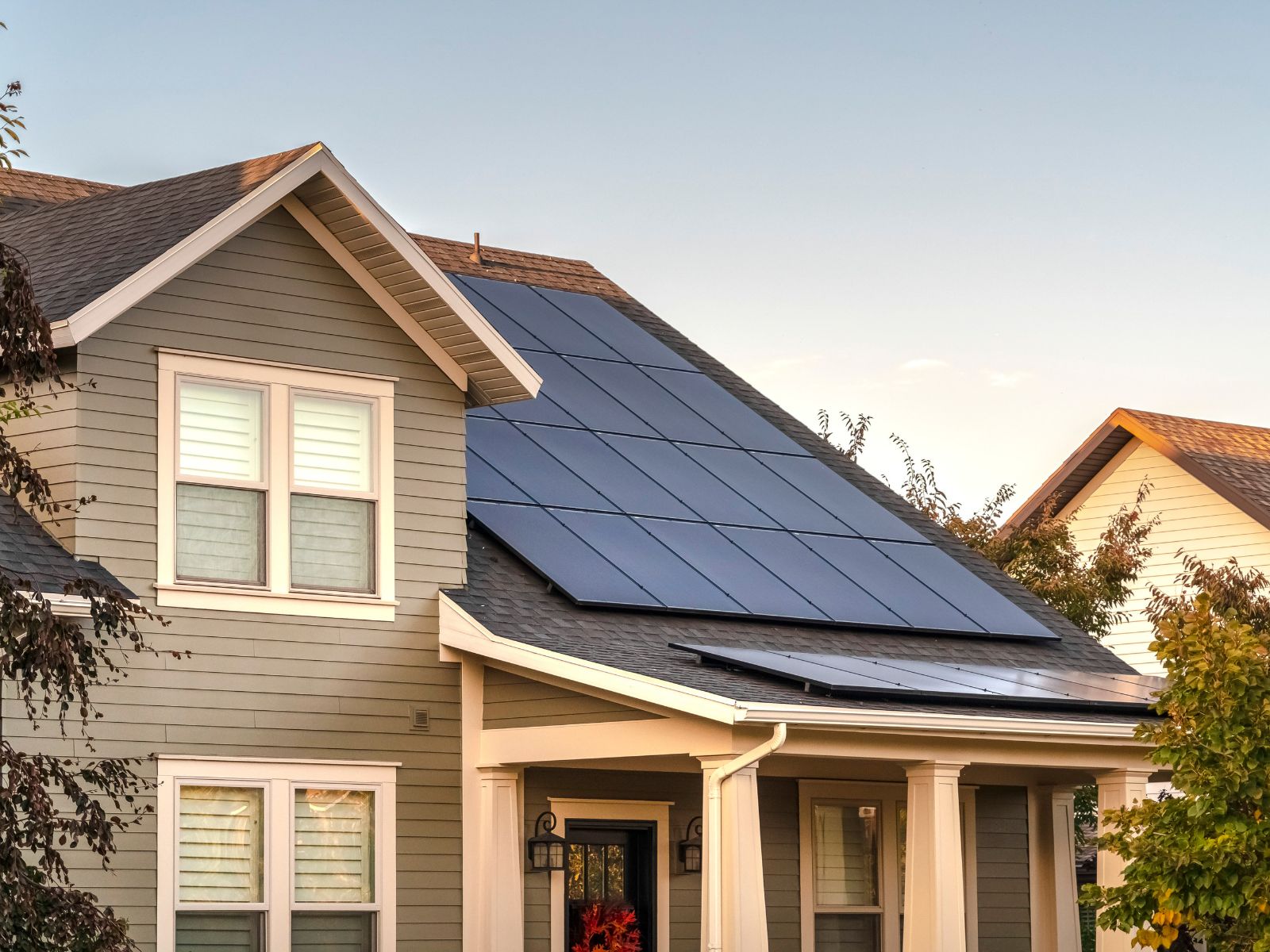 Residential home with rooftop solar panels installed to improve energy efficiency and reduce long-term electricity costs.